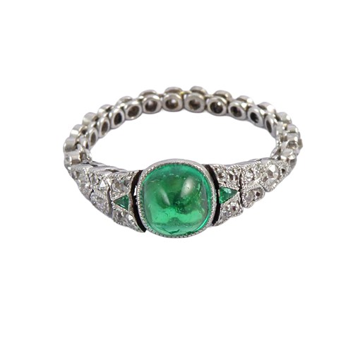 Dainty early 20th century cabochon emerald and diamond ring, c.1910, with articulated diamond shank,